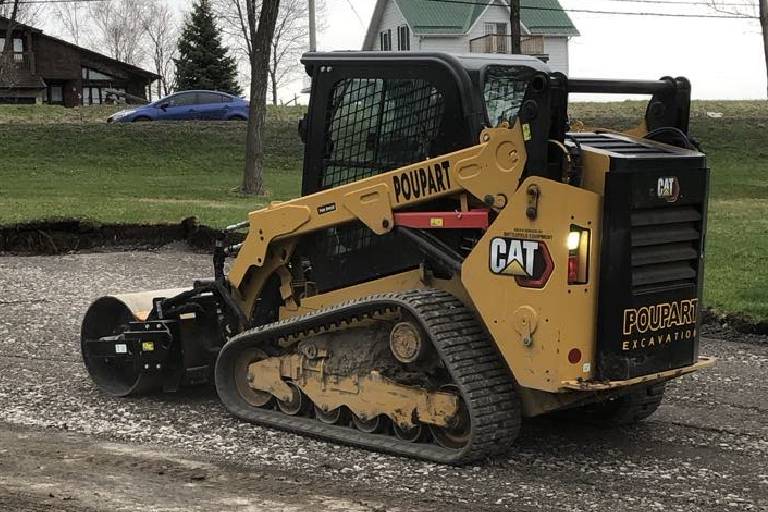 Work being made grading and compacting a driveway by Poupart Excavation